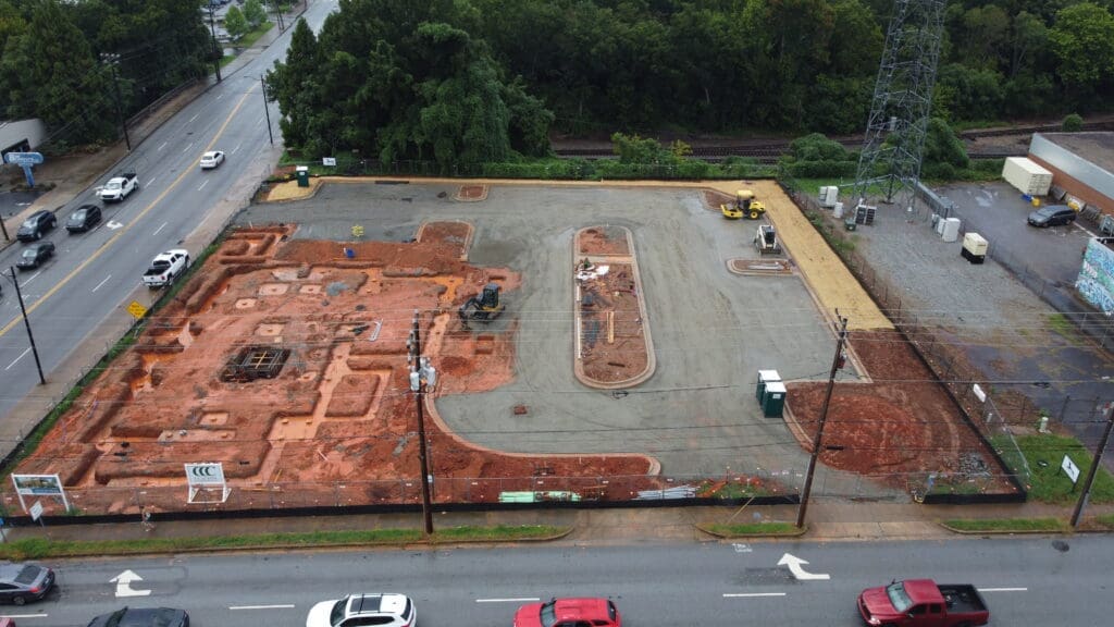 In-progress sitework at Fidelity Bank in Spartanburg, SC, including grading, erosion control, utilities, and paving by S3 Construction for a new 5,528 sq. ft. facility