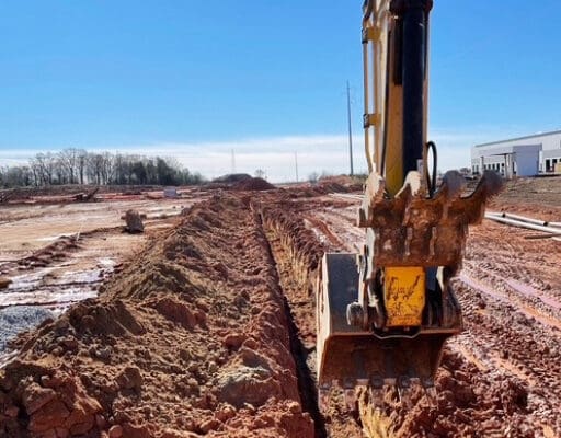 Underground utility infrastructure being installed at a construction site
