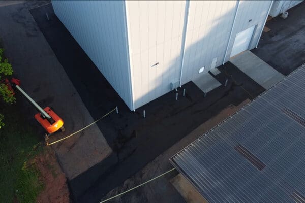 Aerial drone view of the completed Xytel Corporation industrial facility in Roebuck, SC, showcasing sitework including demolition, grading, utilities, stormwater systems, erosion control, and paving by S3 Construction